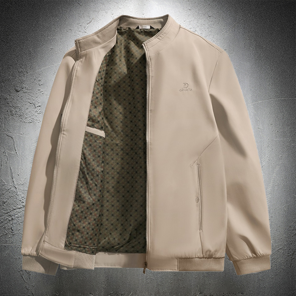 Veste beige sur fond gris.