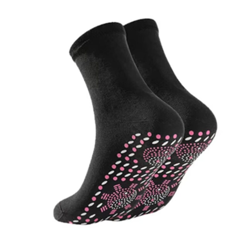Chaussettes de travail noires à stimulation magnétique sur fond blanc